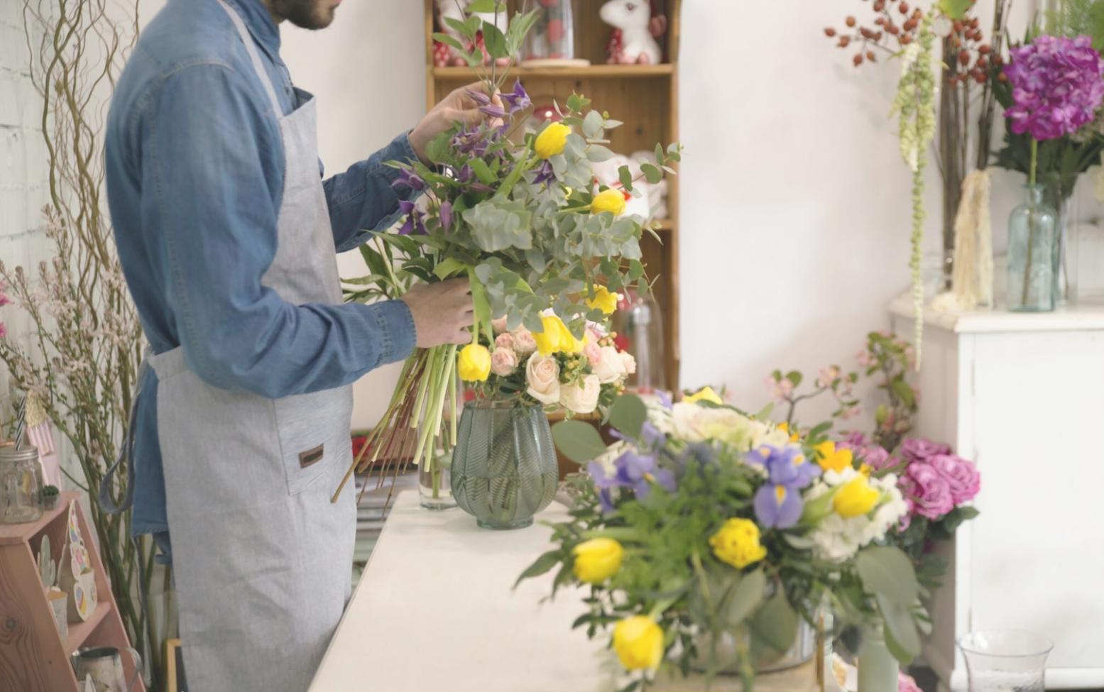 Early floral arrangement workspace showing the humble beginnings of our mobile service